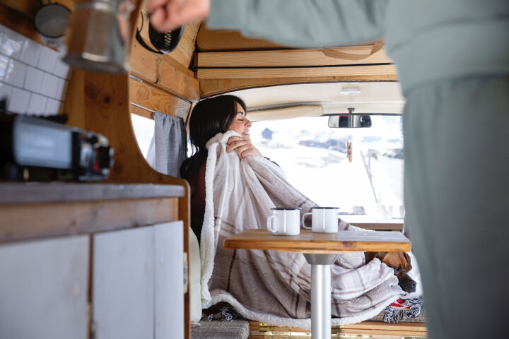 woman-preparing-coffee-herself-her-lover-during-winter-trip