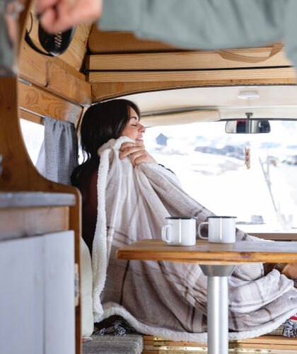 woman-preparing-coffee-herself-her-lover-during-winter-trip