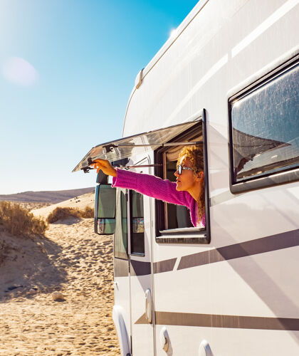 adult-tourist-woman-opening-camper-van-window-enjoy-sun-freedom-concept-travel-people-summer-holiday-vacation-inside-camping-car-motorhome-vehicle-freedom-nomad-lifestyle