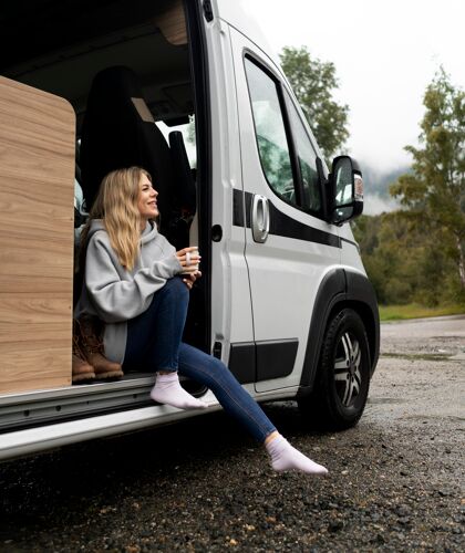 woman-relaxing-her-camper-daylight (1)