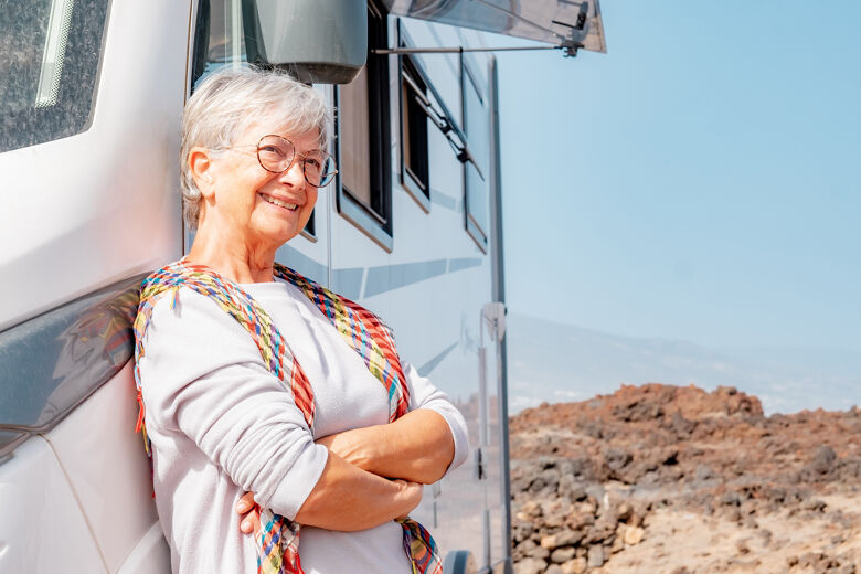 happy-retired-senior-woman-outdoor-her-camper-van-vehicle-enjoying-free-vacation-travel (1)